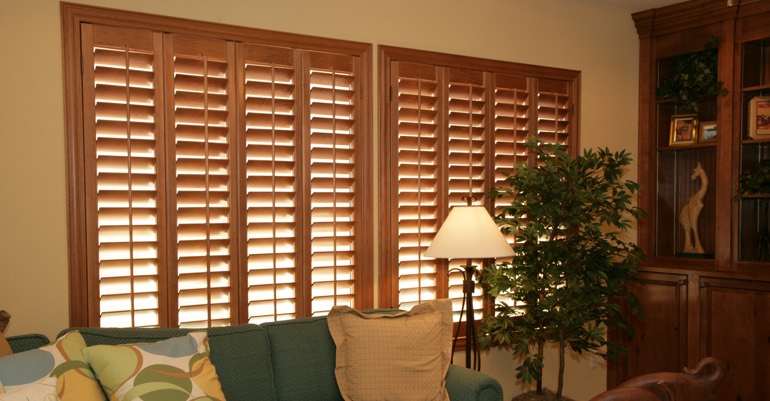 Natural wood shutters in San Diego living room.